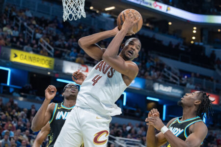 Cleveland Cavaliers forward Evan Mobley (4) rebounds the ball while Indiana Pacers forward Aaron Nesmith (23) defends in the second half at Gainbridge Fieldhouse.