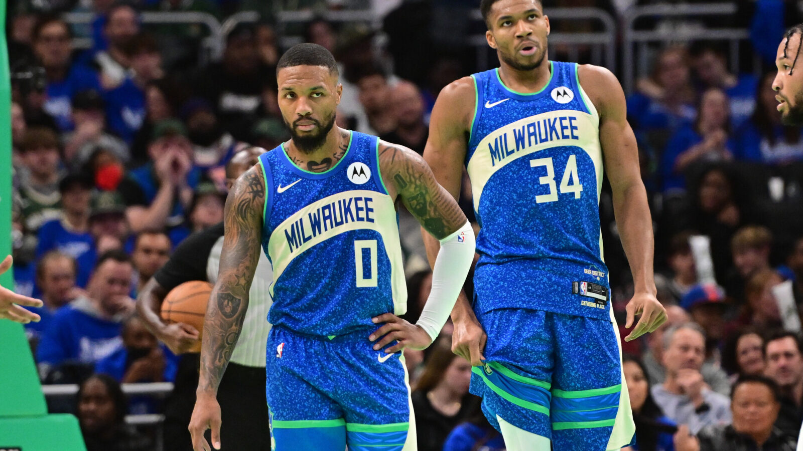Nov 3, 2023; Milwaukee, Wisconsin, USA; Milwaukee Bucks guard Damian Lillard (0) and forward Giannis Antetokounmpo (34) looks on during a timeout in the fourth quarter against the New York Knicks at Fiserv Forum.