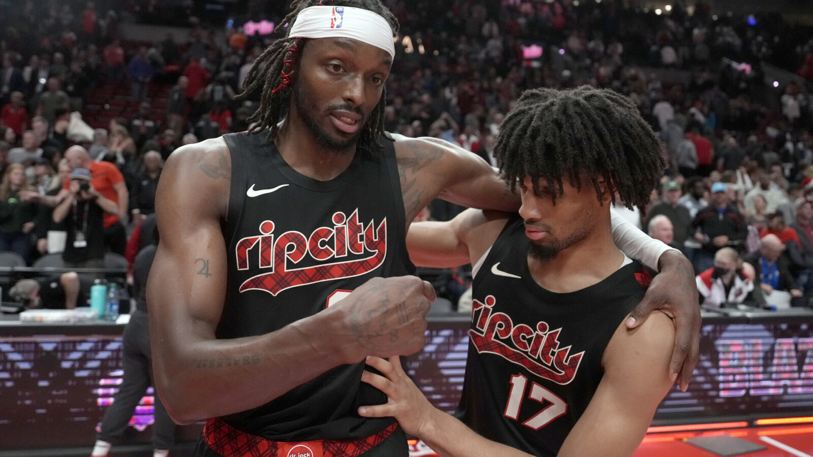 Portland Trail Blazers small forward Jerami Grant (9, left) and shooting guard Shaedon Sharpe (17) celebrate after a victory against the Memphis Grizzlies at Moda Center.