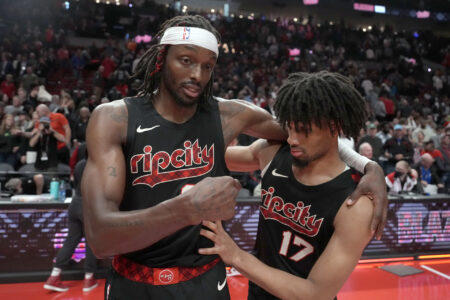 Portland Trail Blazers small forward Jerami Grant (9, left) and shooting guard Shaedon Sharpe (17) celebrate after a victory against the Memphis Grizzlies at Moda Center.