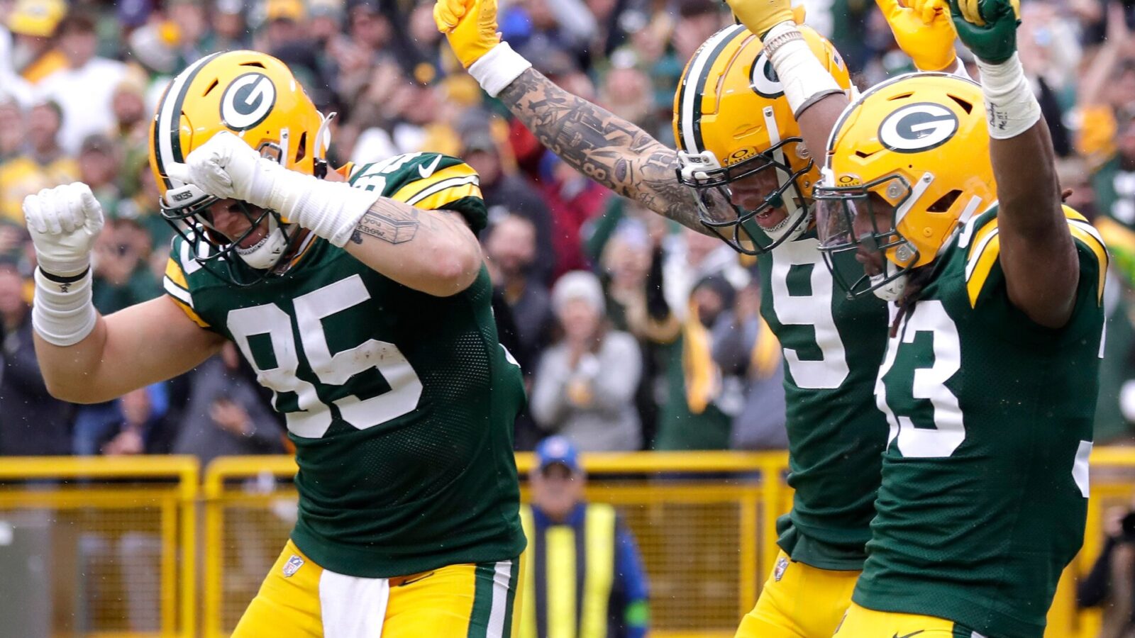 Green Bay Packers running back Aaron Jones (33), wide receiver Christian Watson (9) and tight end Tucker Kraft (85) celebrate a rushing touchdown against the Los Angeles Rams during their football game Sunday, November 5,, 2023, at Lambeau Field in Green Bay, Wis. Wm. Glasheen USA TODAY NETWORK-Wisconsin