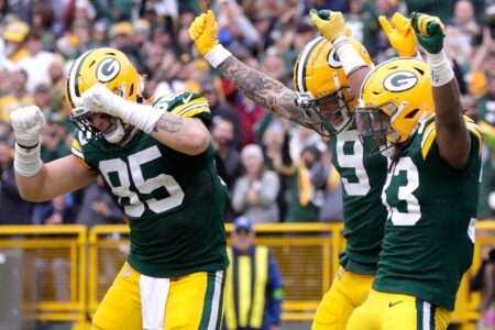 Green Bay Packers running back Aaron Jones (33), wide receiver Christian Watson (9) and tight end Tucker Kraft (85) celebrate a rushing touchdown against the Los Angeles Rams during their football game Sunday, November 5,, 2023, at Lambeau Field in Green Bay, Wis. Wm. Glasheen USA TODAY NETWORK-Wisconsin