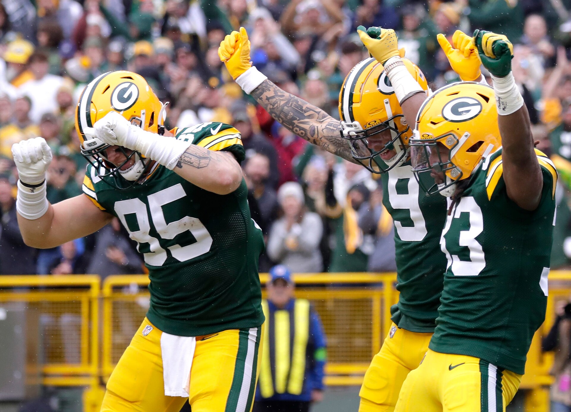 Green Bay Packers running back Aaron Jones (33), wide receiver Christian Watson (9) and tight end Tucker Kraft (85) celebrate a rushing touchdown against the Los Angeles Rams during their football game Sunday, November 5,, 2023, at Lambeau Field in Green Bay, Wis. Wm. Glasheen USA TODAY NETWORK-Wisconsin