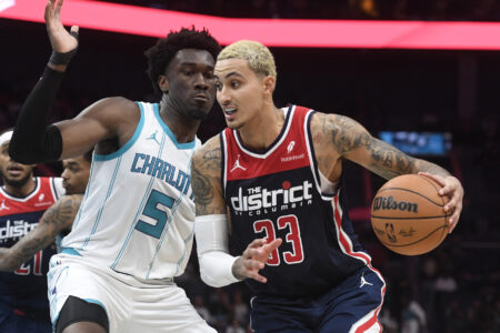 Washington Wizards forward Kyle Kuzma (33) drives past Charlotte Hornets center Mark Williams (5) during the second half at the Spectrum Center.