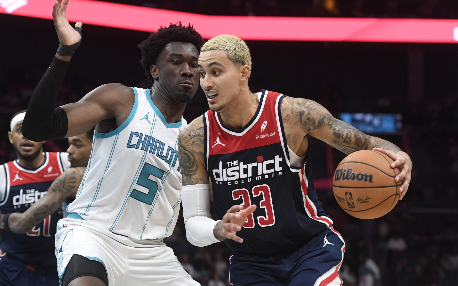 Washington Wizards forward Kyle Kuzma (33) drives past Charlotte Hornets center Mark Williams (5) during the second half at the Spectrum Center.