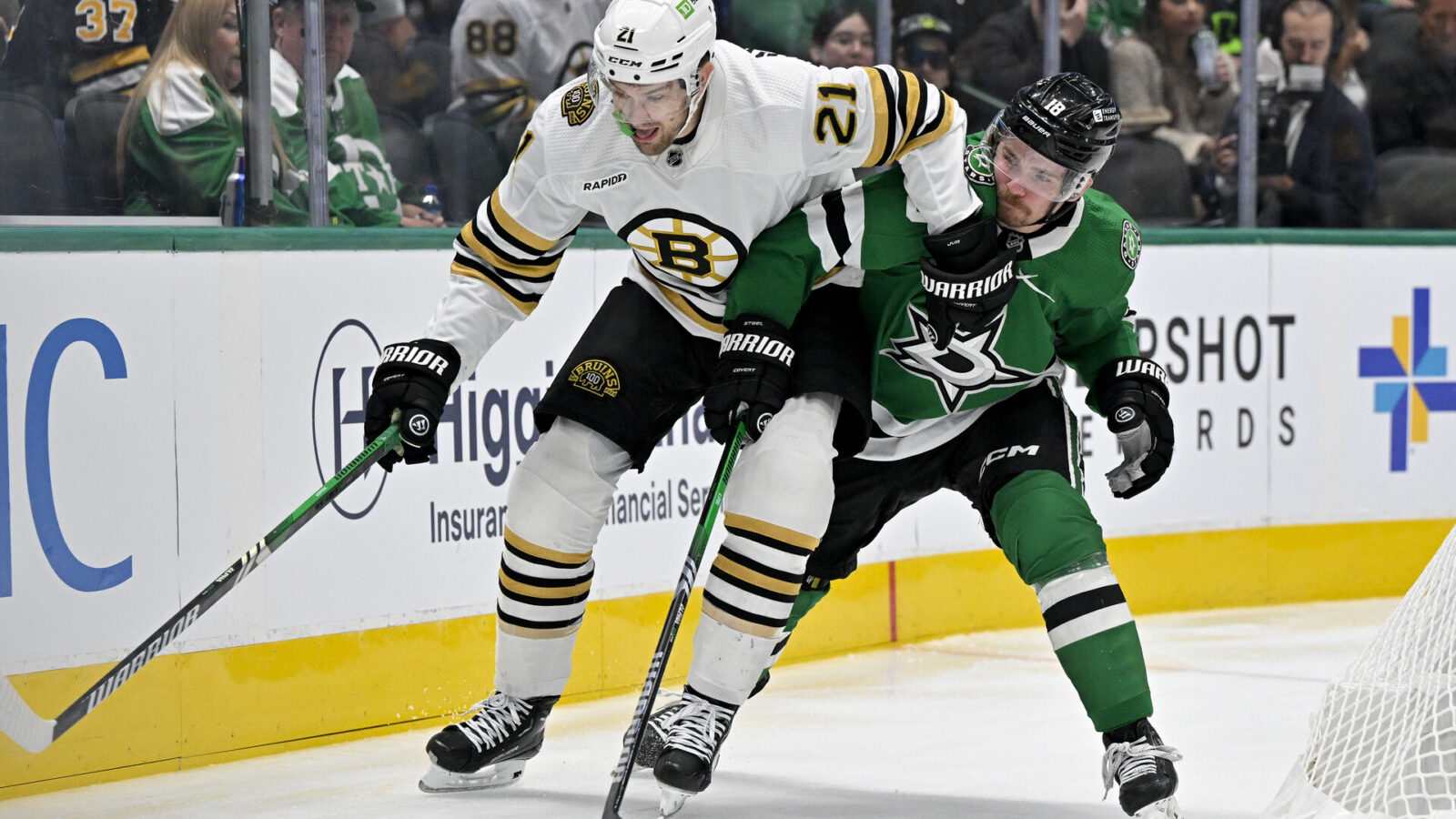 Nov 6, 2023; Dallas, Texas, USA; Boston Bruins left wing James van Riemsdyk (21) and Dallas Stars center Sam Steel (18) in action during the game between the Dallas Stars and the Boston Bruins at the American Airlines Center