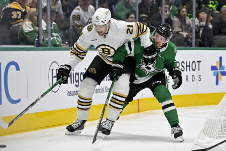 Nov 6, 2023; Dallas, Texas, USA; Boston Bruins left wing James van Riemsdyk (21) and Dallas Stars center Sam Steel (18) in action during the game between the Dallas Stars and the Boston Bruins at the American Airlines Center