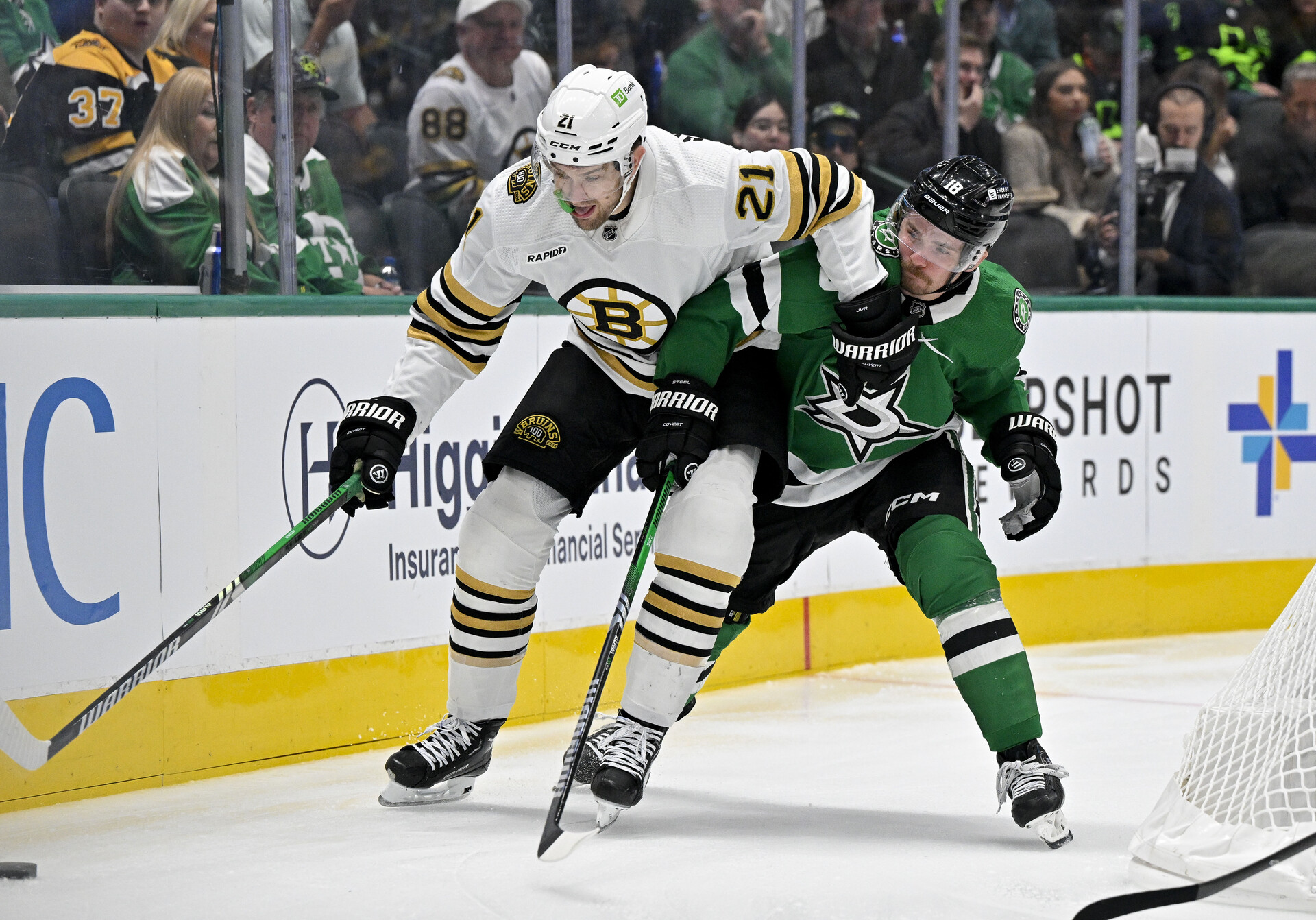 Nov 6, 2023; Dallas, Texas, USA; Boston Bruins left wing James van Riemsdyk (21) and Dallas Stars center Sam Steel (18) in action during the game between the Dallas Stars and the Boston Bruins at the American Airlines Center