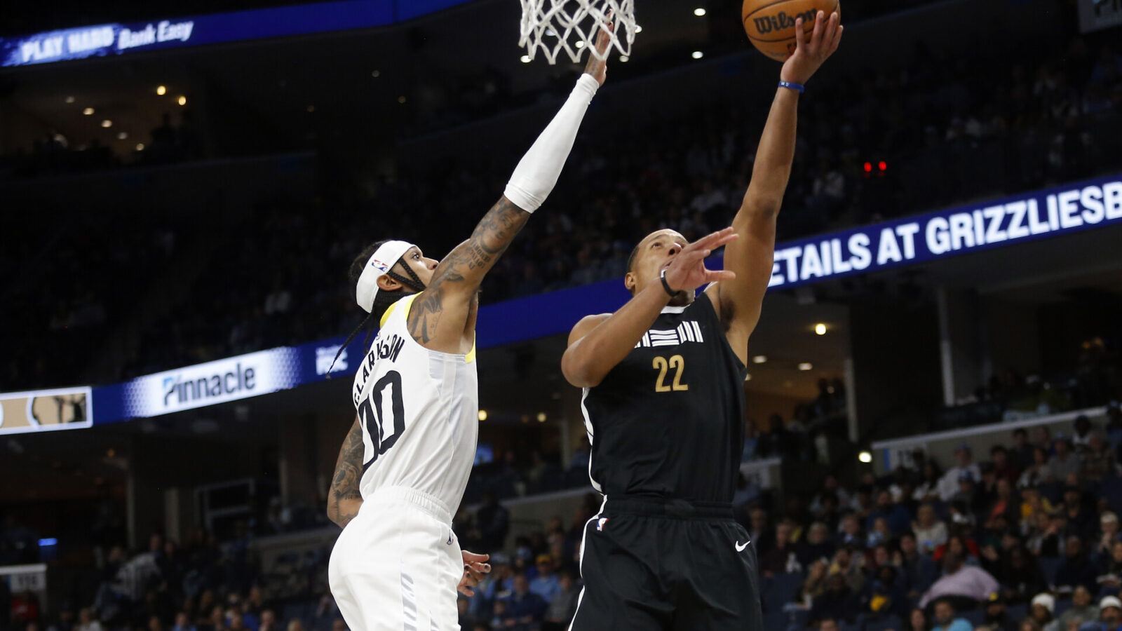 Nov 10, 2023; Memphis, Tennessee, USA; Memphis Grizzlies guard Desmond Bane (22) drives to the basket as Utah Jazz guard Jordan Clarkson (0) defends during the first half at FedExForum.