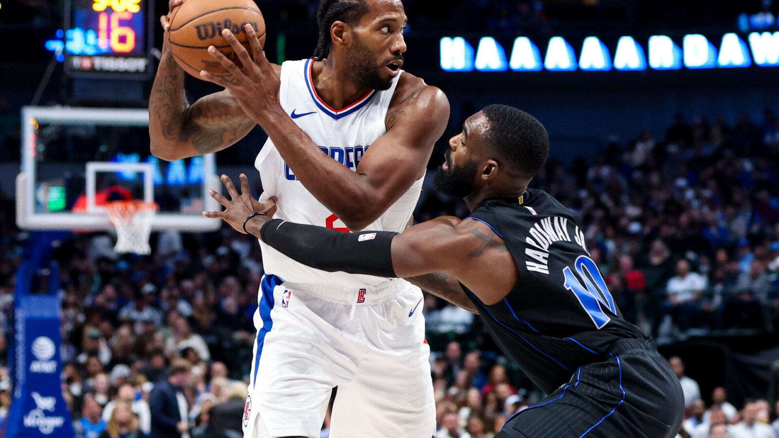 Nov 10, 2023; Dallas, Texas, USA; LA Clippers forward Kawhi Leonard (2) looks to pass as Dallas Mavericks forward Tim Hardaway Jr. (10) defends during the second half at American Airlines Center.