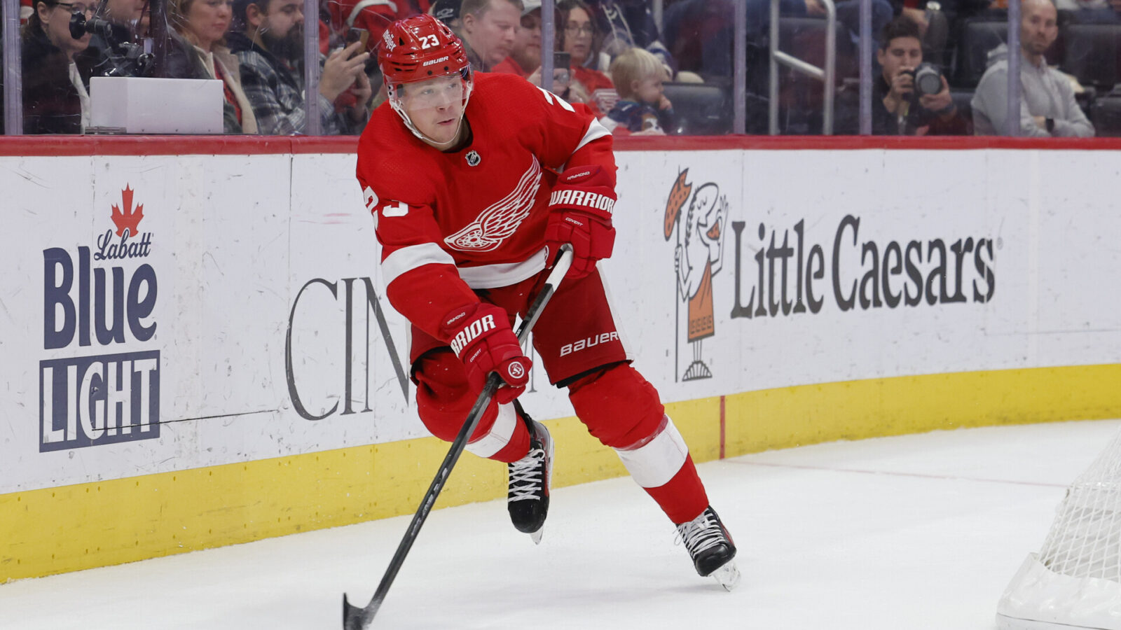 Nov 11, 2023; Detroit, Michigan, USA; Detroit Red Wings left wing Lucas Raymond (23) skates with the puck against the Columbus Blue Jackets in the second period at Little Caesars Arena.