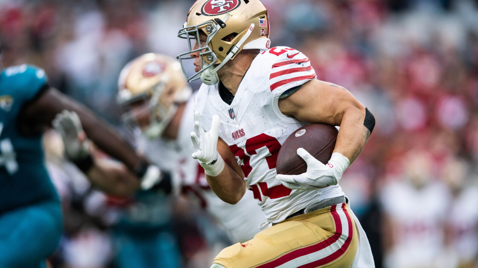 Nov 12, 2023; Jacksonville, Florida, USA; San Fransisco 49ers running back Christian McCaffrey (23) runs with the ball against the Jacksonville Jaguars in the second quarter at EverBank Stadium.
