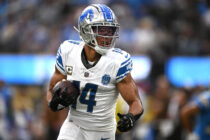 Detroit Lions wide receiver Amon-Ra St. Brown (14) runs with the ball against the Los Angeles Chargers during the first half at SoFi Stadium.