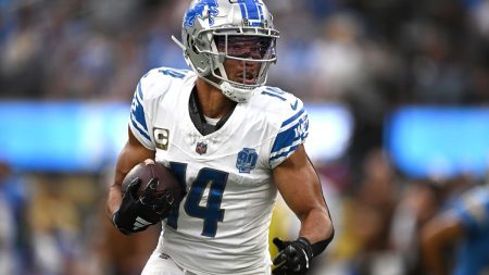 Detroit Lions wide receiver Amon-Ra St. Brown (14) runs with the ball against the Los Angeles Chargers during the first half at SoFi Stadium.
