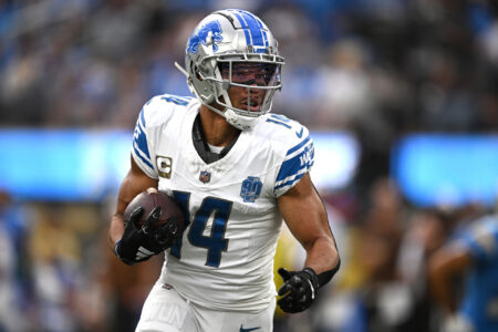 Detroit Lions wide receiver Amon-Ra St. Brown (14) runs with the ball against the Los Angeles Chargers during the first half at SoFi Stadium.
