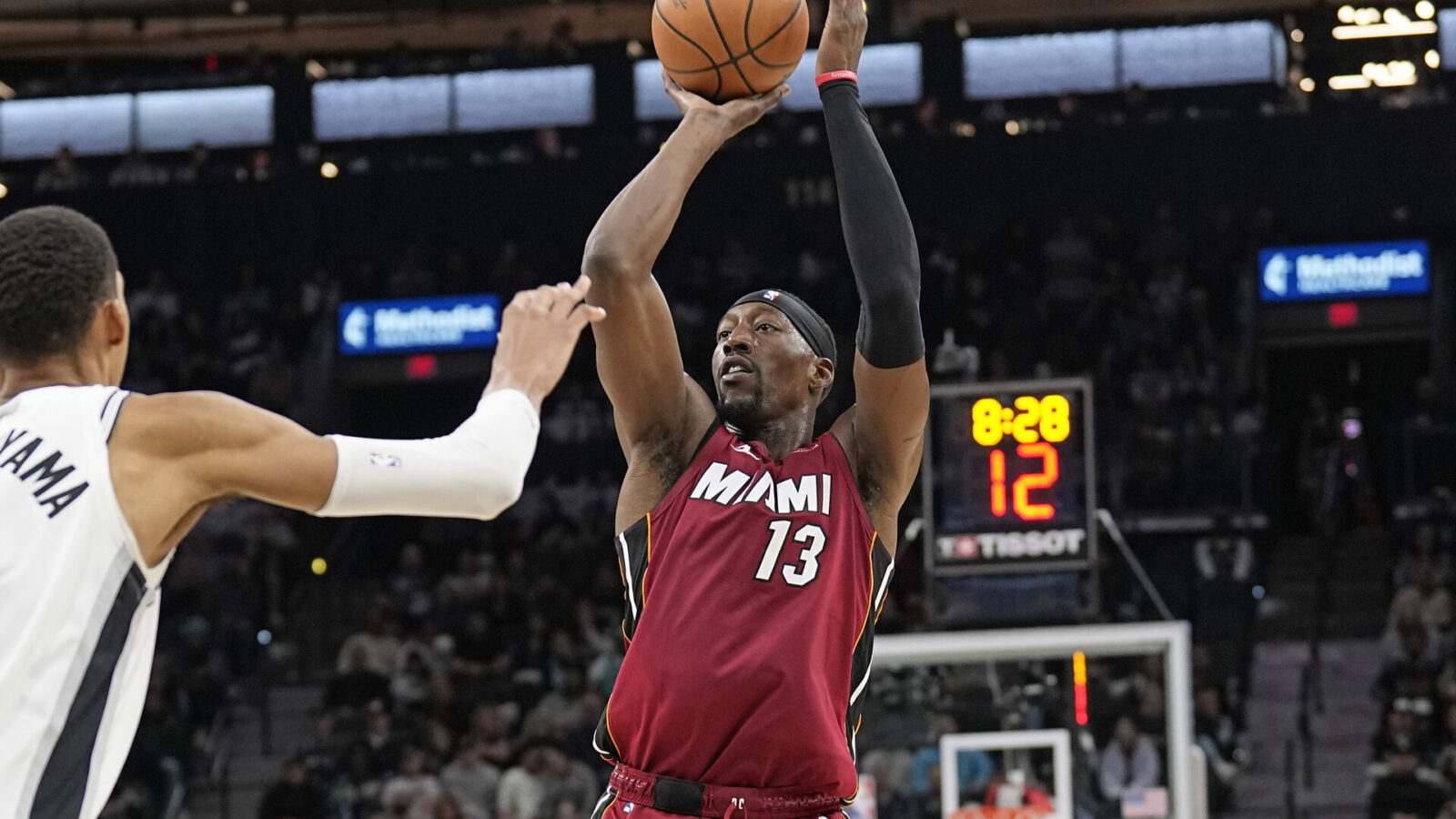 Nov 12, 2023; San Antonio, Texas, USA; Miami Heat center Bam Adebayo (13) shoots during the second half against the San Antonio Spurs at Frost Bank Center.