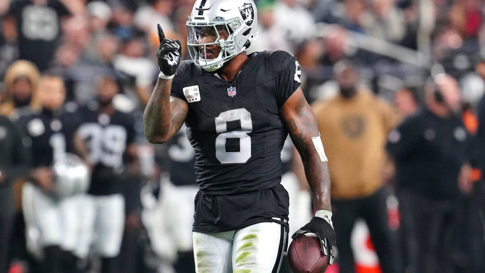 Nov 12, 2023; Paradise, Nevada, USA; Las Vegas Raiders running back Josh Jacobs (8) gestures after making a first down against the New York Jets during the third quarter at Allegiant Stadium.