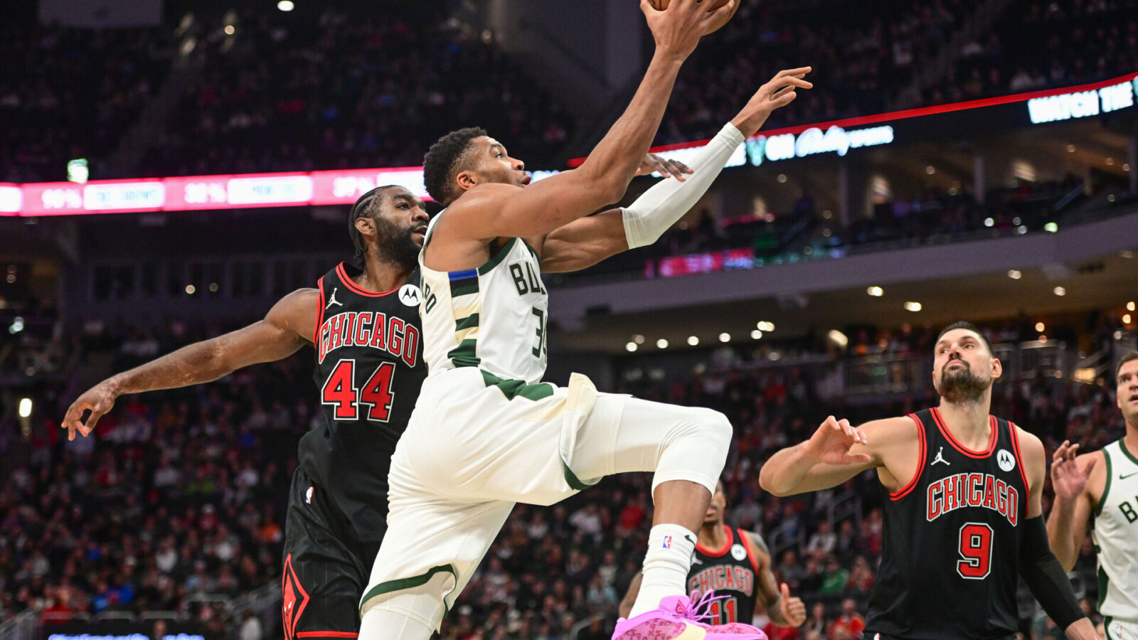 Nov 13, 2023; Milwaukee, Wisconsin, USA; Milwaukee Bucks forward Giannis Antetokounmpo (34) goes to the basket against Chicago Bulls forward Patrick Williams (44) and center Nikola Vucevic (9) in the fourth quarter at Fiserv Forum.