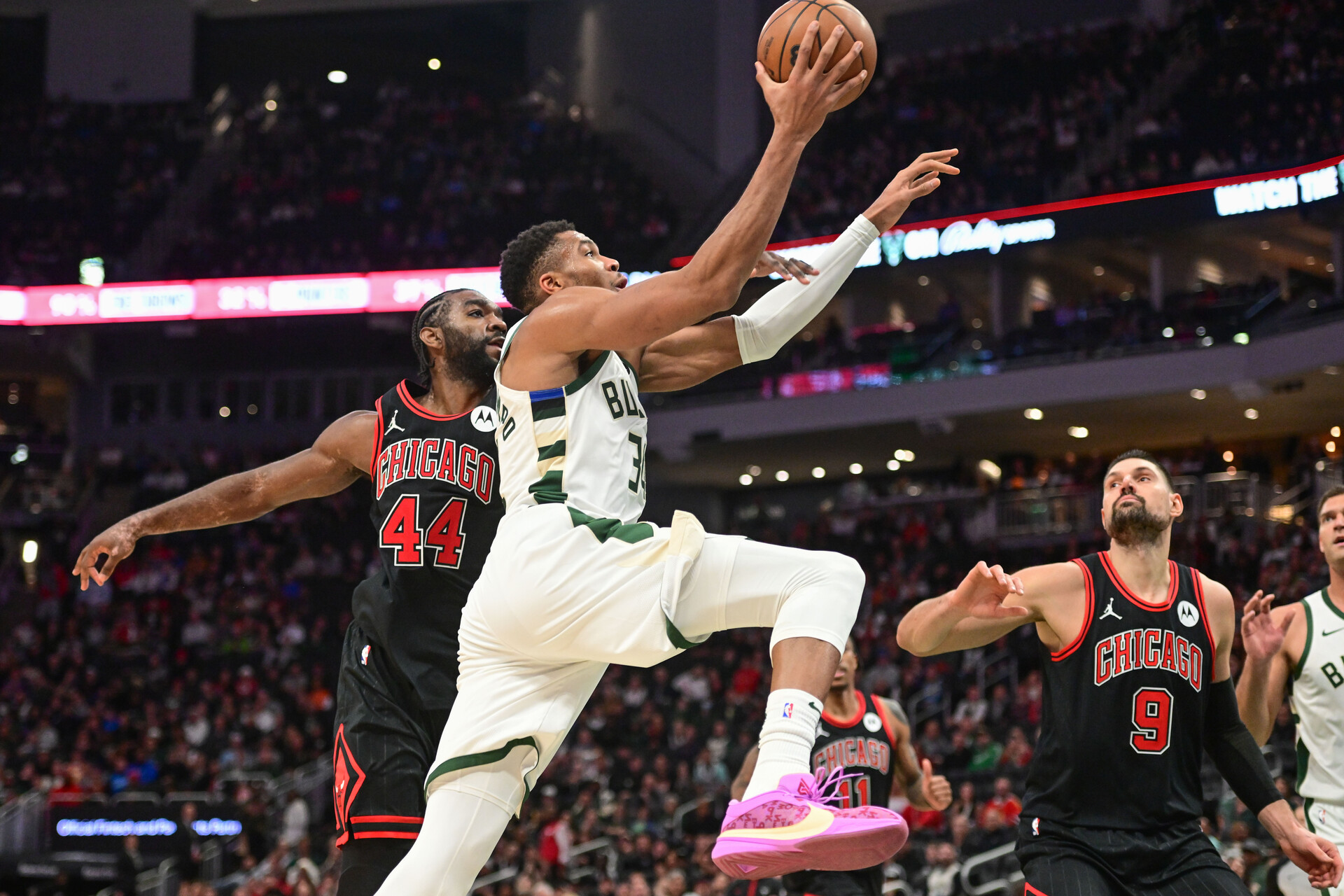 Nov 13, 2023; Milwaukee, Wisconsin, USA; Milwaukee Bucks forward Giannis Antetokounmpo (34) goes to the basket against Chicago Bulls forward Patrick Williams (44) and center Nikola Vucevic (9) in the fourth quarter at Fiserv Forum.