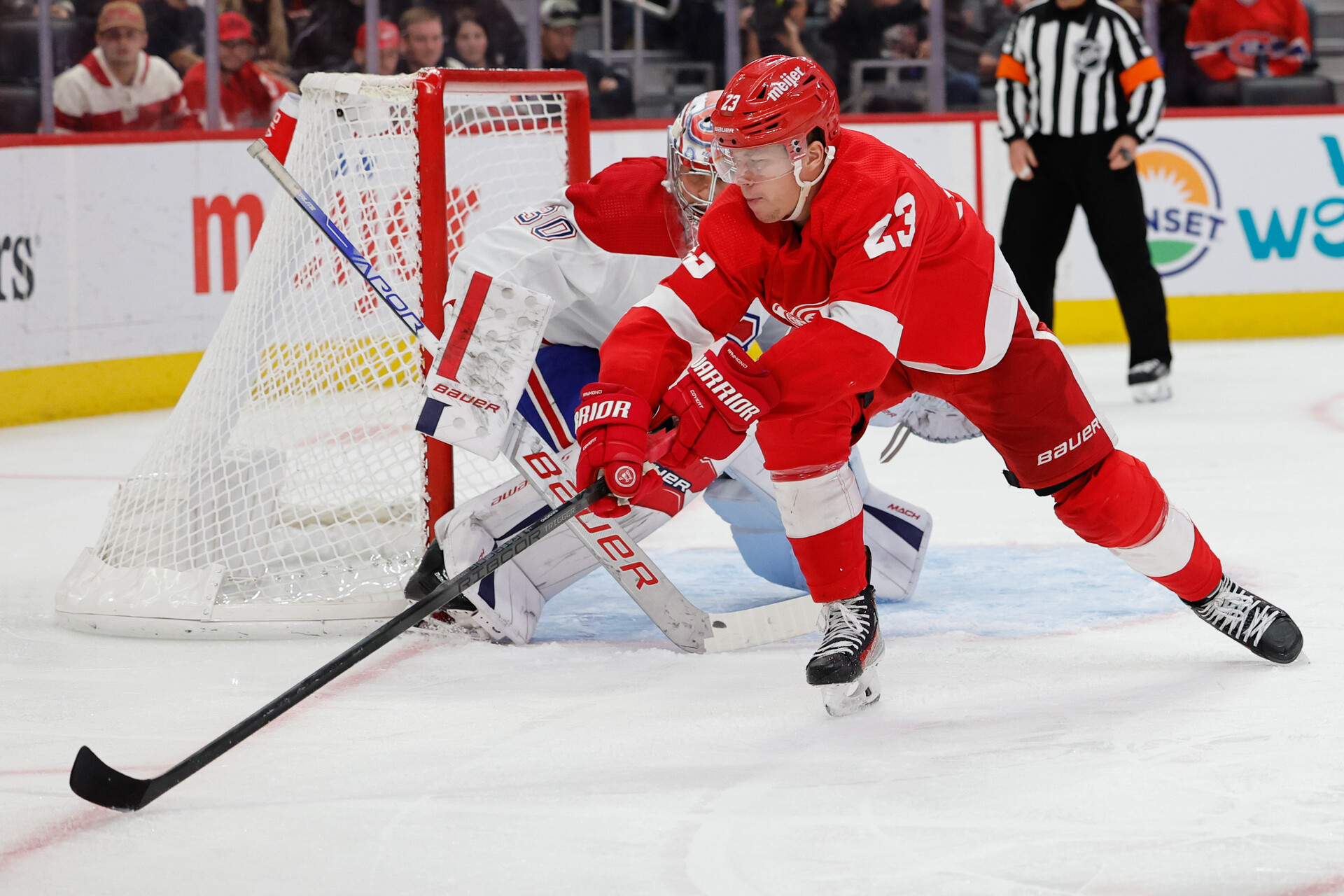 Nov 9, 2023; Detroit, Michigan, USA; Detroit Red Wings left wing Lucas Raymond (23) skates with the puck in the second period against the Montreal Canadiens at Little Caesars Arena.