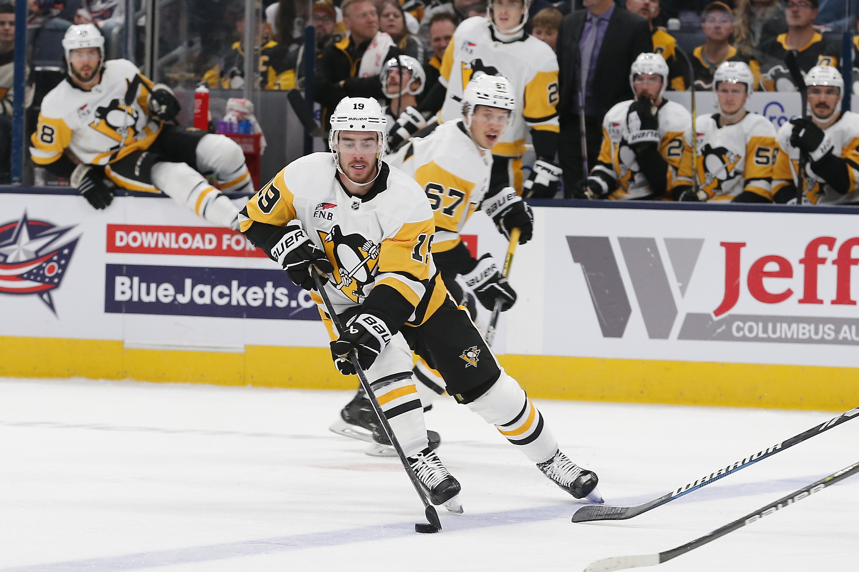 Nov 14, 2023; Columbus, Ohio, USA; Pittsburgh Penguins right wing Reilly Smith (19) skates with the puck against the Columbus Blue Jackets during the second period at Nationwide Arena.