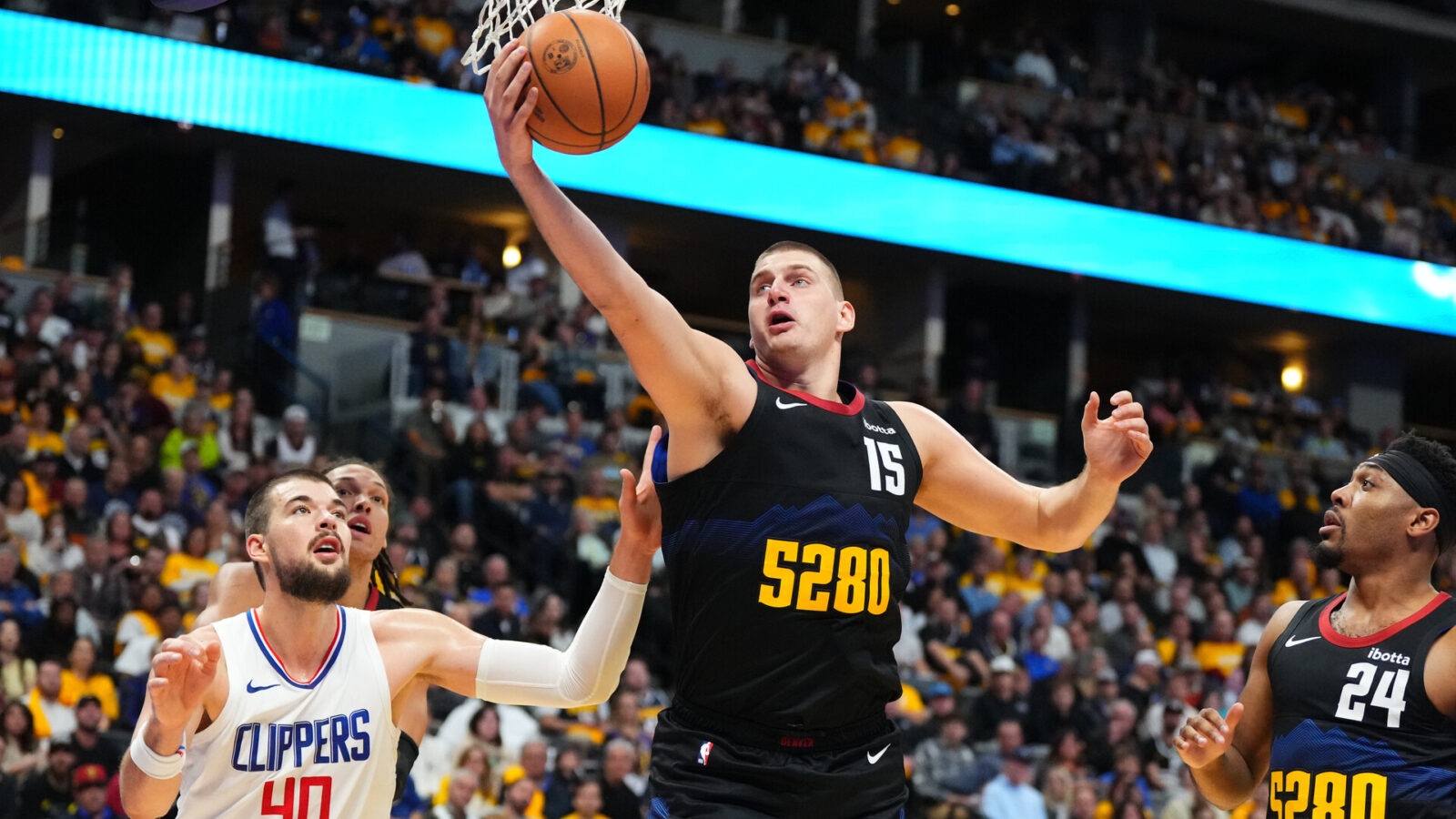 Nov 14, 2023; Denver, Colorado, USA; Denver Nuggets center Nikola Jokic (15) rebounds the ball past LA Clippers center Ivica Zubac (40) in the second quarter at Ball Arena.
