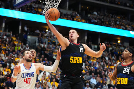 Nov 14, 2023; Denver, Colorado, USA; Denver Nuggets center Nikola Jokic (15) rebounds the ball past LA Clippers center Ivica Zubac (40) in the second quarter at Ball Arena.