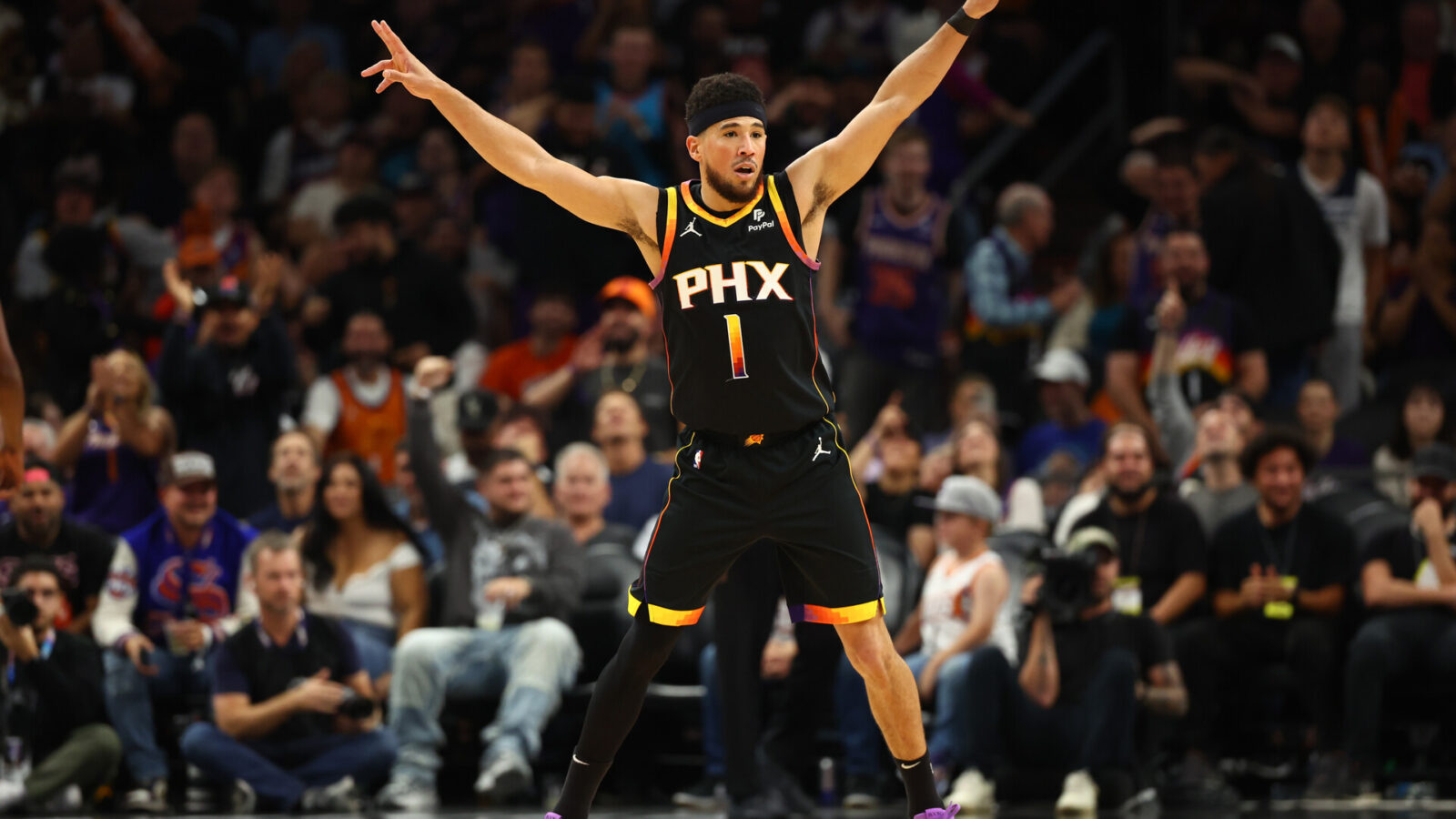 Nov 15, 2023; Phoenix, Arizona, USA; Phoenix Suns guard Devin Booker (1) reacts against the Minnesota Timberwolves in the first half at Footprint Center.