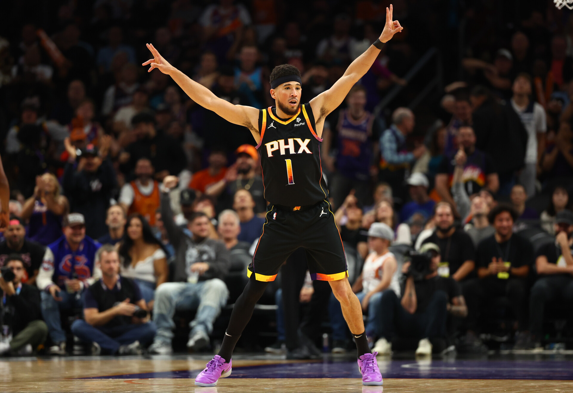 Nov 15, 2023; Phoenix, Arizona, USA; Phoenix Suns guard Devin Booker (1) reacts against the Minnesota Timberwolves in the first half at Footprint Center.