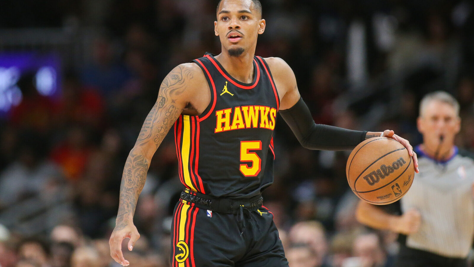 Nov 15, 2023; Atlanta, Georgia, USA; Atlanta Hawks guard Dejounte Murray (5) dribbles against the New York Knicks in the second half at State Farm Arena.