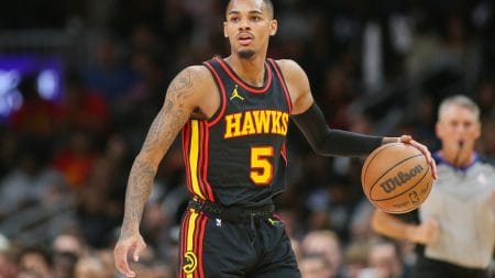 Nov 15, 2023; Atlanta, Georgia, USA; Atlanta Hawks guard Dejounte Murray (5) dribbles against the New York Knicks in the second half at State Farm Arena.