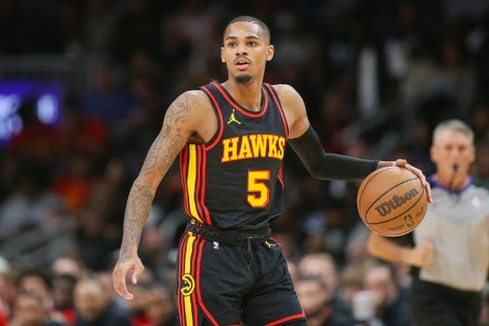 Nov 15, 2023; Atlanta, Georgia, USA; Atlanta Hawks guard Dejounte Murray (5) dribbles against the New York Knicks in the second half at State Farm Arena.