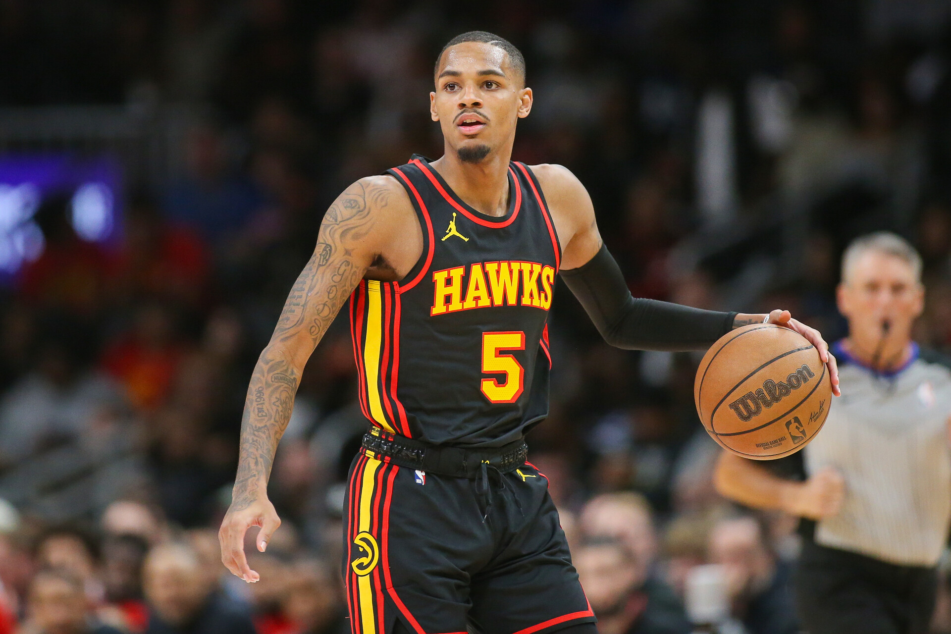 Nov 15, 2023; Atlanta, Georgia, USA; Atlanta Hawks guard Dejounte Murray (5) dribbles against the New York Knicks in the second half at State Farm Arena.
