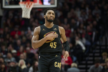 Nov 15, 2023; Portland, Oregon, USA; Cleveland Cavaliers guard Donovan Mitchell (45) reacts after scoring a three point basket during the second half against the Portland Trail Blazers at Moda Center.