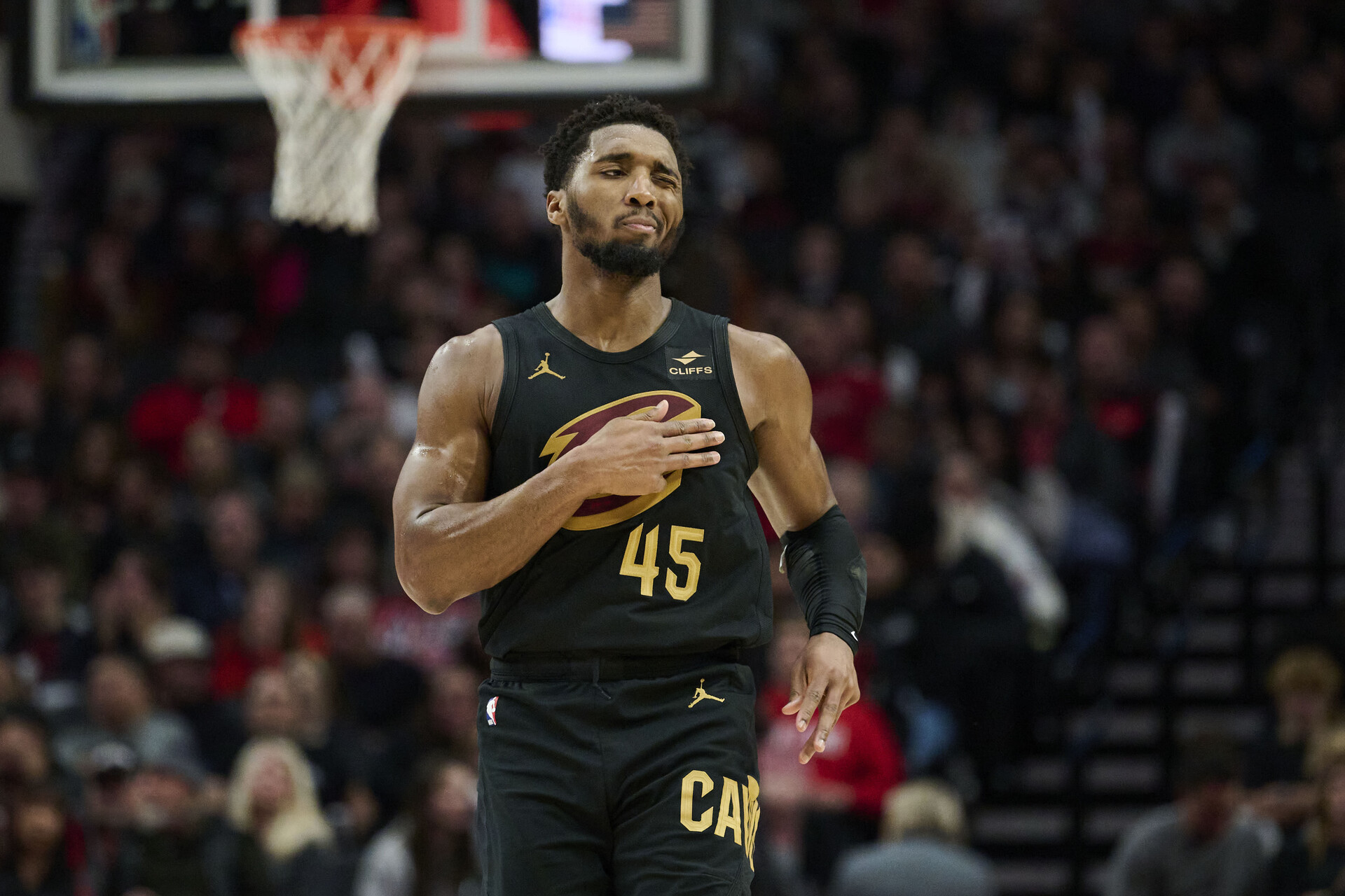 Nov 15, 2023; Portland, Oregon, USA; Cleveland Cavaliers guard Donovan Mitchell (45) reacts after scoring a three point basket during the second half against the Portland Trail Blazers at Moda Center.