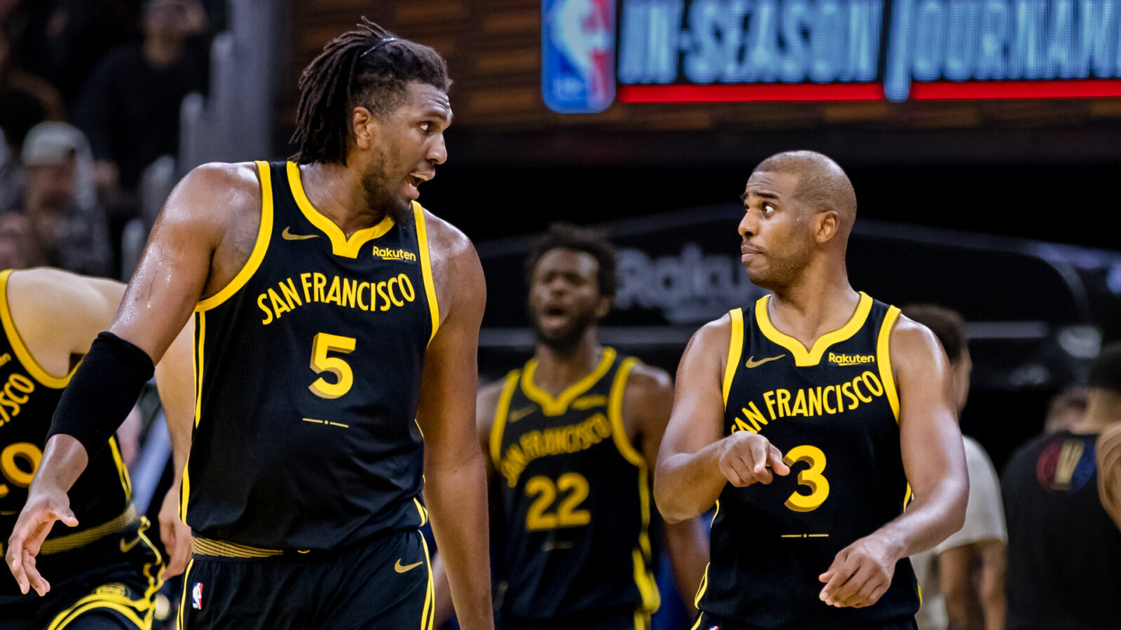 Golden State Warriors forward Kevon Looney (5) and guard Chris Paul (3) re-enter the court after a time-out during the second half of the game against the Minnesota Timberwolves at Chase Center.