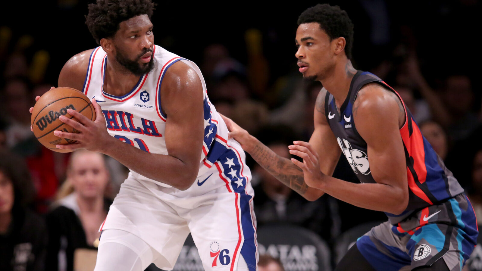 Nov 19, 2023; Brooklyn, New York, USA; Philadelphia 76ers center Joel Embiid (21) controls the ball against Brooklyn Nets center Nic Claxton (33) during the third quarter at Barclays Center.