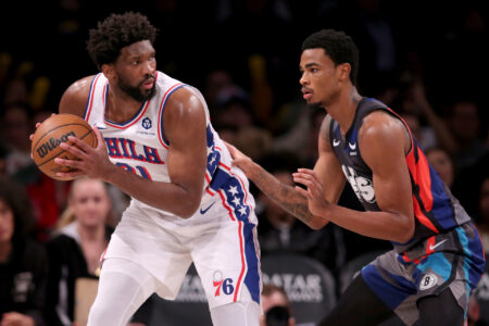 Nov 19, 2023; Brooklyn, New York, USA; Philadelphia 76ers center Joel Embiid (21) controls the ball against Brooklyn Nets center Nic Claxton (33) during the third quarter at Barclays Center.
