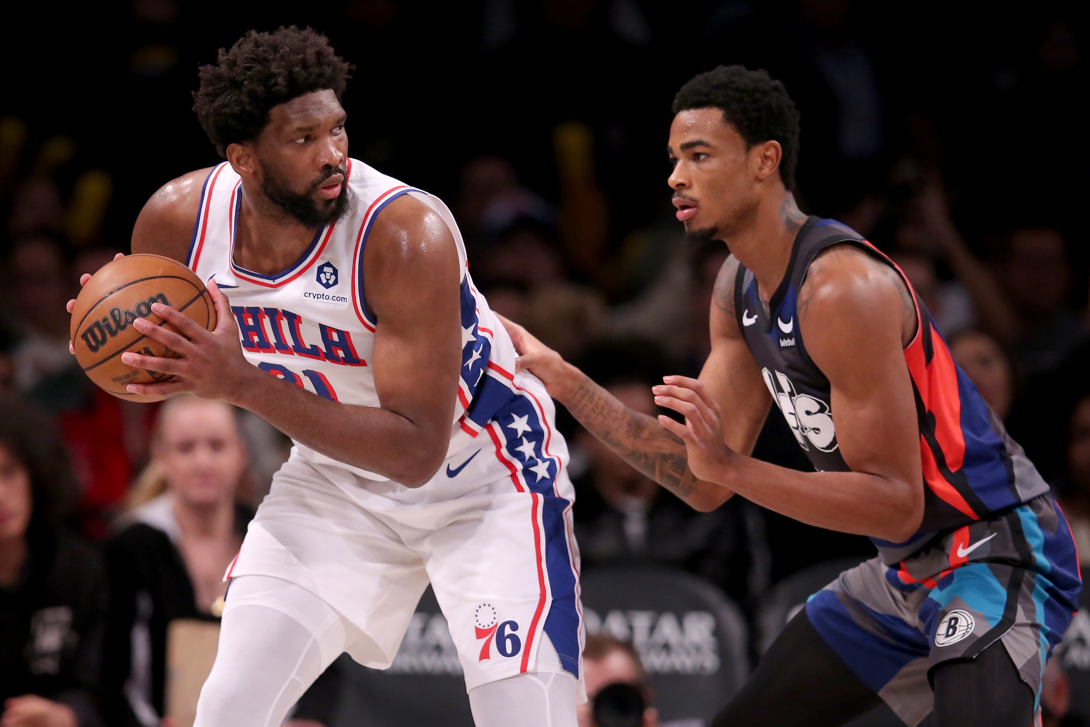 Nov 19, 2023; Brooklyn, New York, USA; Philadelphia 76ers center Joel Embiid (21) controls the ball against Brooklyn Nets center Nic Claxton (33) during the third quarter at Barclays Center.