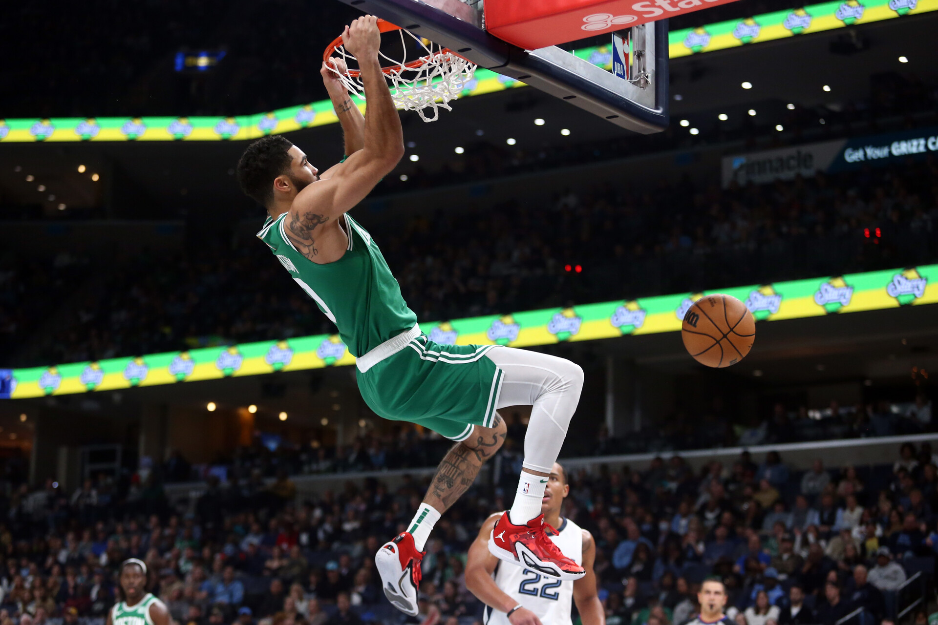 Nov 19, 2023; Memphis, Tennessee, USA; Boston Celtics forward Jayson Tatum (0) dunks during the first half against the Memphis Grizzlies at FedExForum.