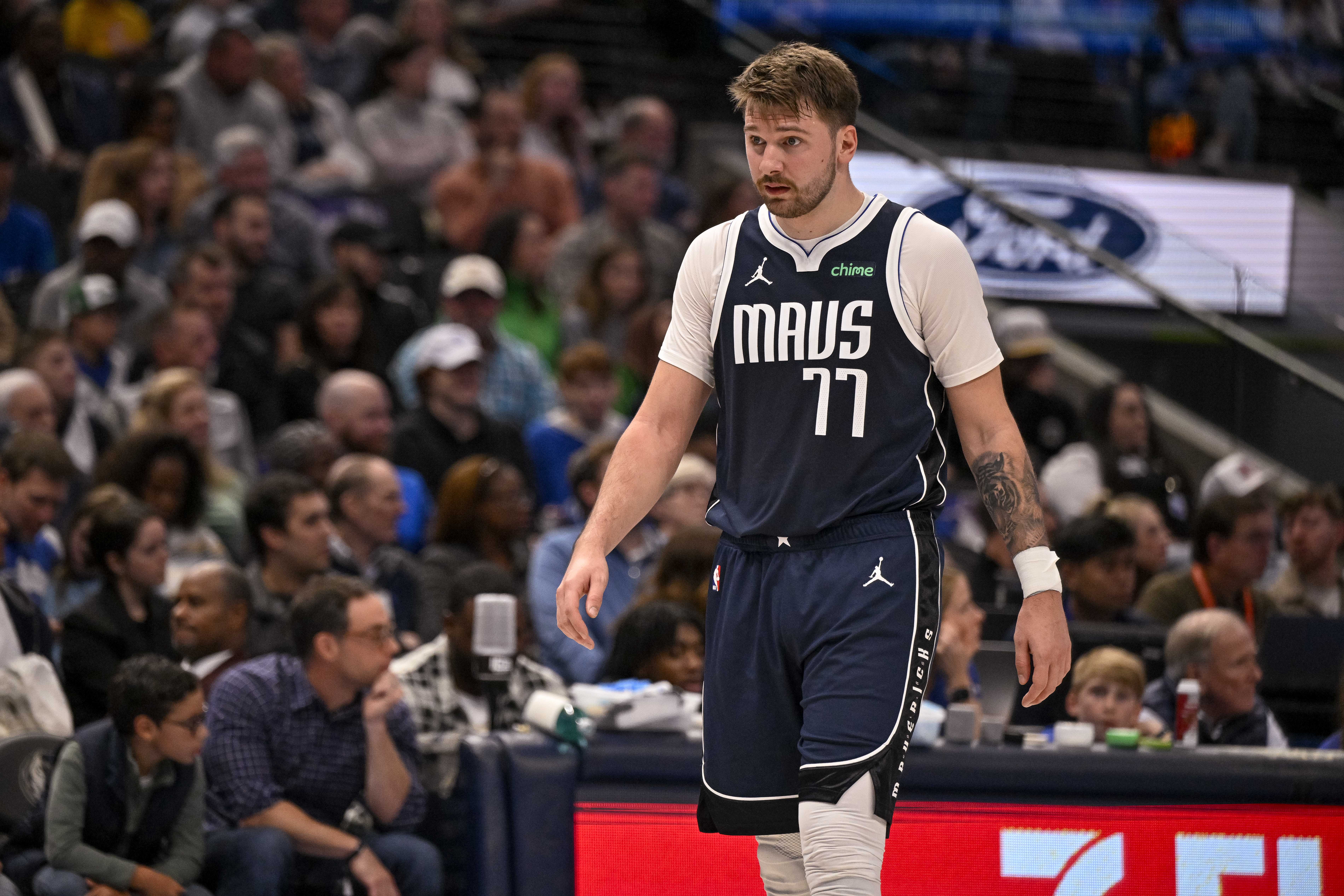 Nov 19, 2023; Dallas, Texas, USA; Dallas Mavericks guard Luka Doncic (77) walks back up the court during the second quarter against the Sacramento Kings at the American Airlines Center.