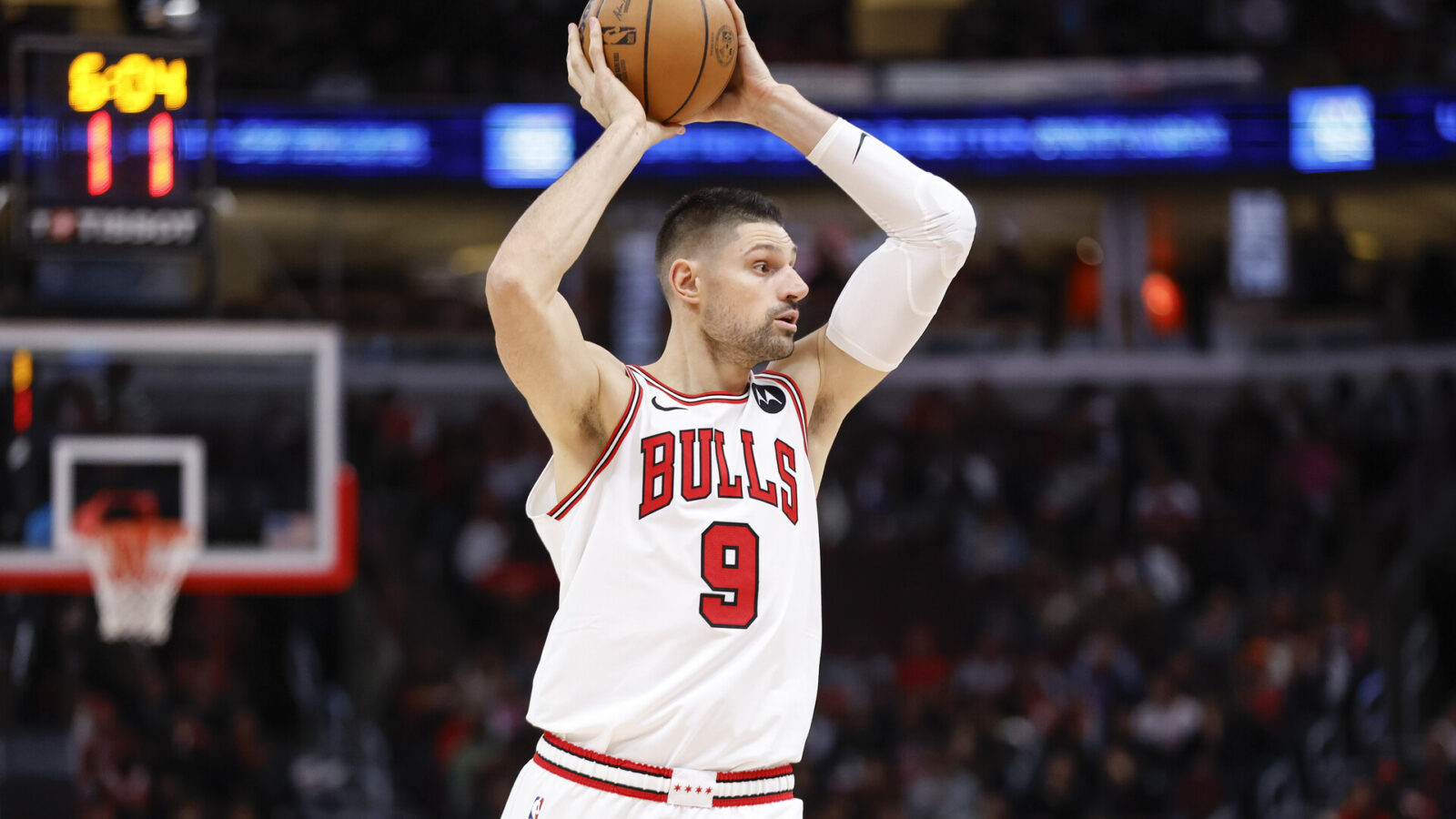 Nov 20, 2023; Chicago, Illinois, USA; Chicago Bulls center Nikola Vucevic (9) looks to pass the ball against the Miami Heat during the first half at United Center.