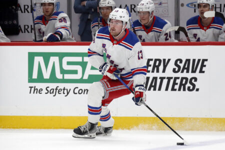 Nov 22, 2023; Pittsburgh, Pennsylvania, USA; New York Rangers left wing Alexis Lafreniere (13) skates with the puck against the Pittsburgh Penguins during the first period at PPG Paints Arena.