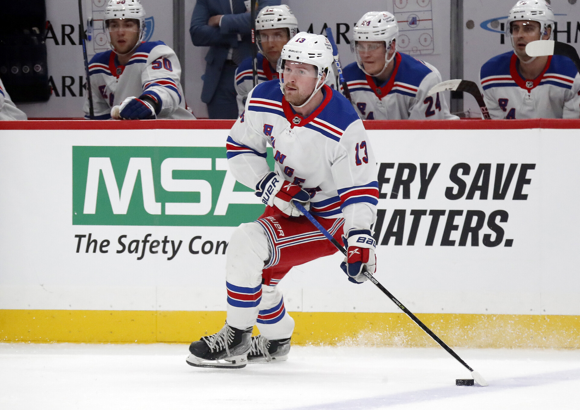 Nov 22, 2023; Pittsburgh, Pennsylvania, USA; New York Rangers left wing Alexis Lafreniere (13) skates with the puck against the Pittsburgh Penguins during the first period at PPG Paints Arena.