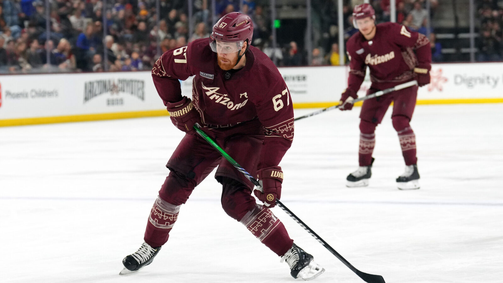 Nov 22, 2023; Tempe, Arizona, USA; Arizona Coyotes left wing Lawson Crouse (67) shoots against the St. Louis Blues during the first period at Mullett Arena.