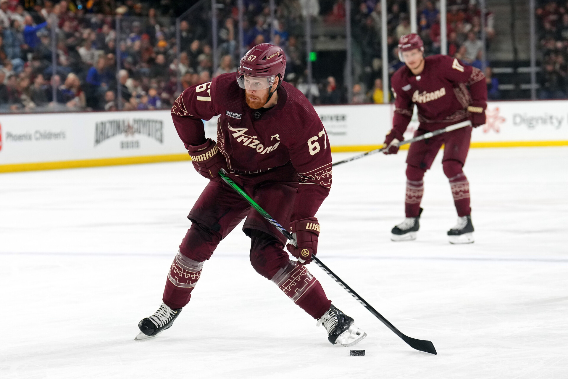 Nov 22, 2023; Tempe, Arizona, USA; Arizona Coyotes left wing Lawson Crouse (67) shoots against the St. Louis Blues during the first period at Mullett Arena.