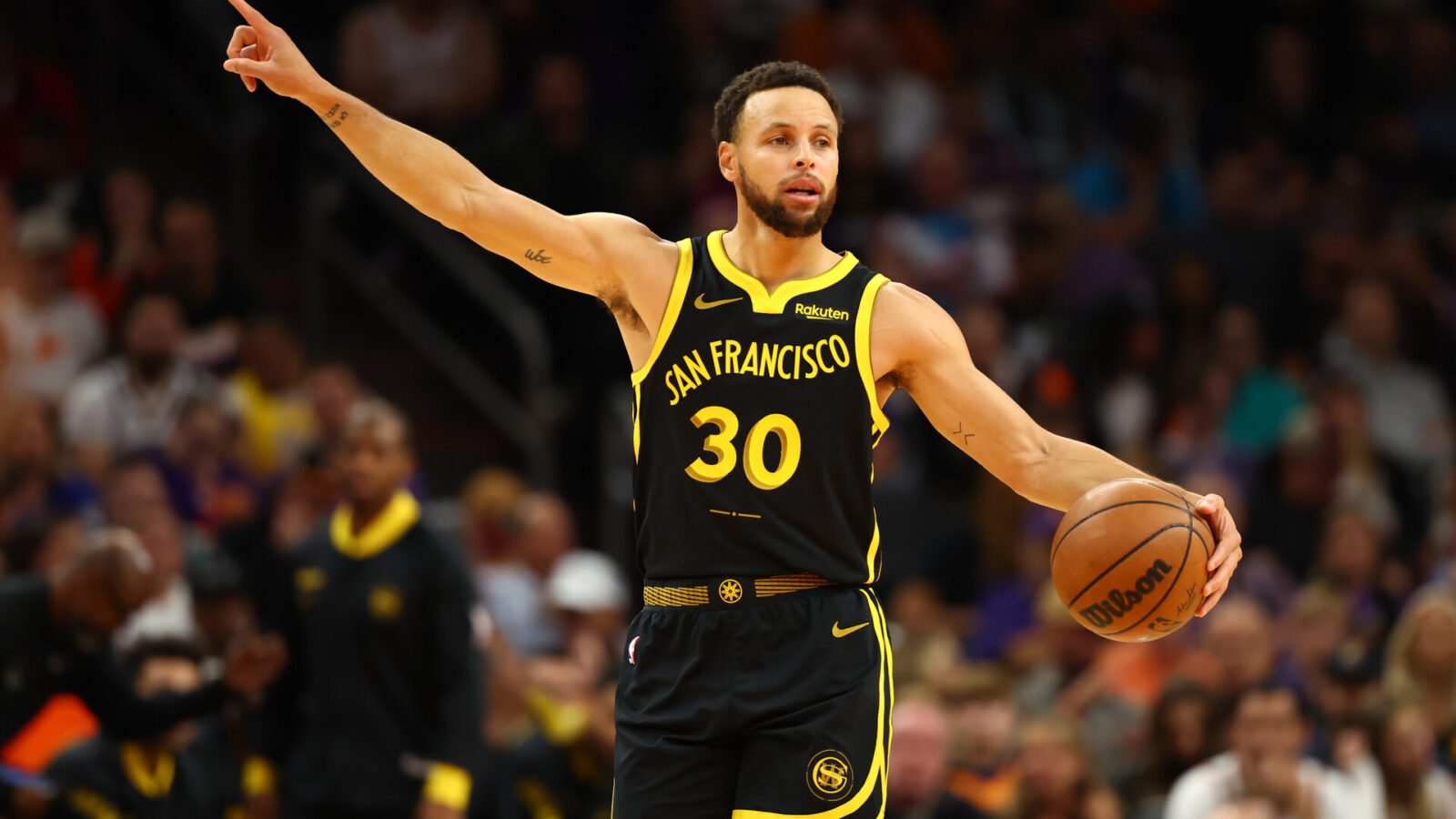 Nov 22, 2023; Phoenix, Arizona, USA; Golden State Warriors guard Stephen Curry (30) reacts against the Phoenix Suns in the first half at Footprint Center.