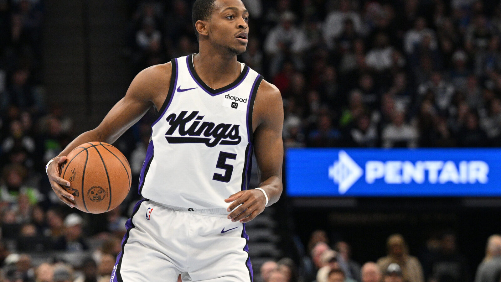 Nov 24, 2023; Minneapolis, Minnesota, USA; Sacramento Kings guard De'Aaron Fox (5) handles the ball against the Minnesota Timberwolves during the first quarter at Target Center.