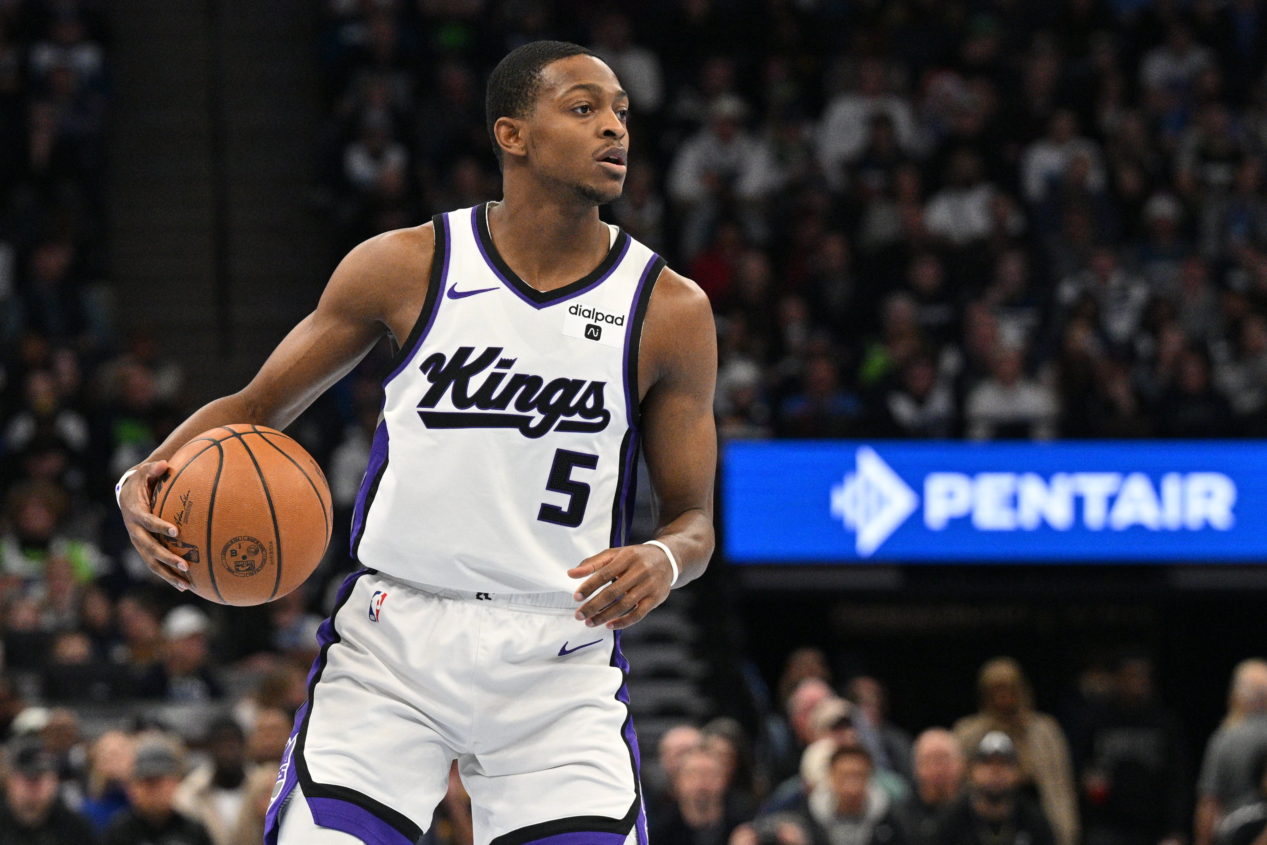 Nov 24, 2023; Minneapolis, Minnesota, USA; Sacramento Kings guard De'Aaron Fox (5) handles the ball against the Minnesota Timberwolves during the first quarter at Target Center.