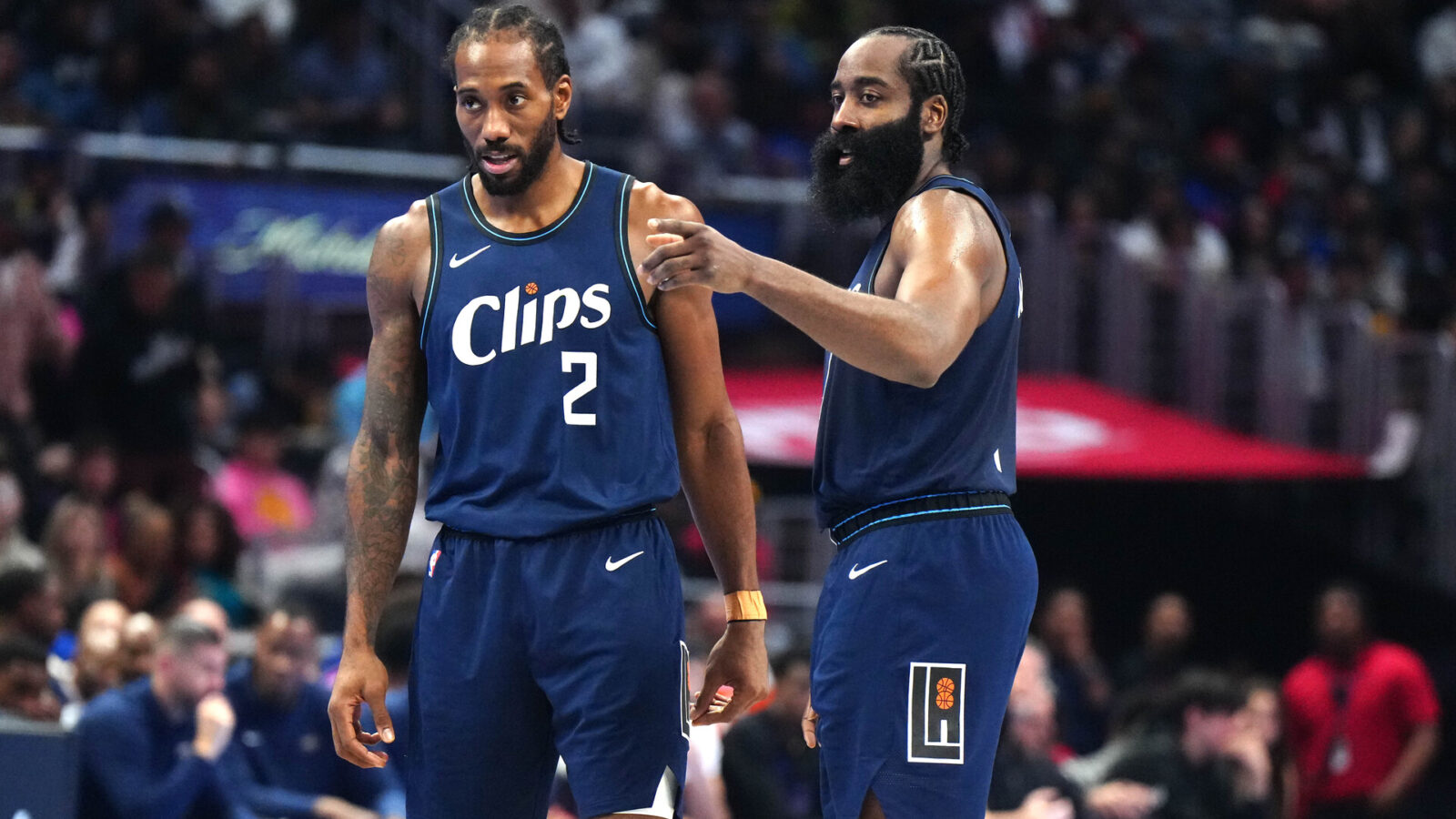 Nov 24, 2023; Los Angeles, California, USA; LA Clippers forward Kawhi Leonard (2) and guard James Harden (1) talk during their game against the New Orleans Pelicans in the second half at Crypto.com Arena